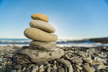 Fototapeta na wymiar Balancing sea stone on sea background