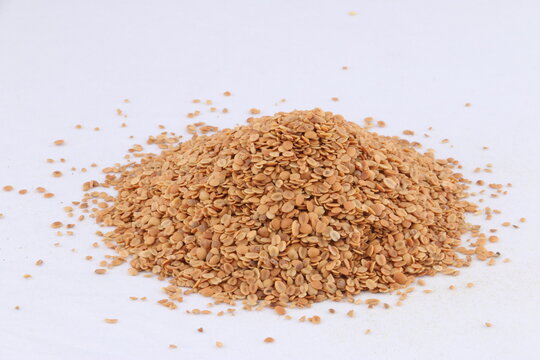 Split Roasted Coriander Seeds also know as Dhana Dal or Sukh Mukh isolated on White Background