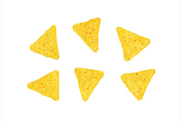 Salty crunchy and crispy triangle mexican corn nachos isolated on white background.
