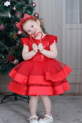 little girl with christmas tree