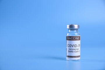 Coronavirus vaccine - The medical concept. Ampoule with Covid-19, SARS-Cov-2 vaccine. Copyspace. Vaccination, immunization, treatment to cure Covid 19 Corona Virus infection Concept