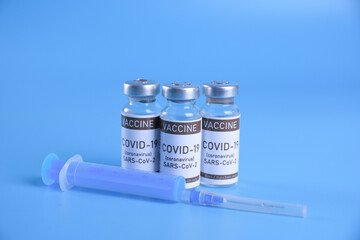 Coronavirus vaccine - The medical concept. Ampoule with Covid-19, SARS-Cov-2 vaccine. Copyspace....