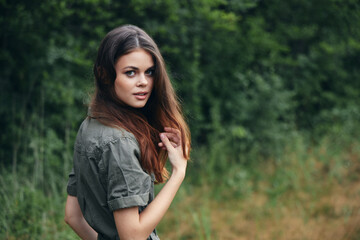 Portrait of a woman fresh air Attractive look green suit walk 