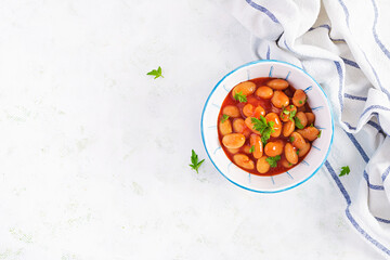 Stewed  beans in tomato sauce with spices.  Vegan food. Top view, flat lay, copy space