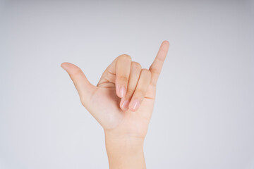 Y in hand sign language. Six in Chinese language. Carabao hand gesture isolate over white background.