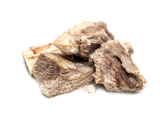 Pieces of boiled meat on a white isolated background.