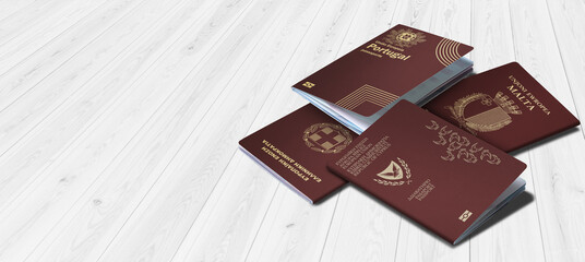 Passports of Malta, Cyprus, Portugal and Greece on a wooden background