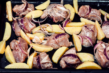 Grilled potatoes and meat . Tasty meal . High calorie food