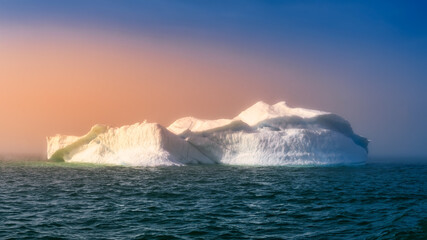 Fototapeta na wymiar floating glaciers in the rays of the setting sun during a polar night