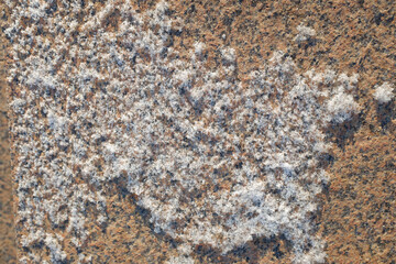 Granite stone wall under the snow.