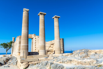 ruins of the ancient acropolis temple building in the greece city of lindos rhodes on a sunny day...
