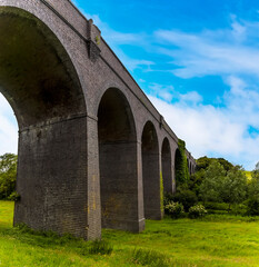 A close-up view along the side of the derelict and abandoned viaduct near Catesby, Northamptonshire, UK