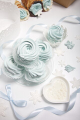 Zephyr on the table surface. Wafer cones filled with marshmallows. With white and dark chocolate.