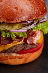 tasty burger with beef cutlet and vegetables