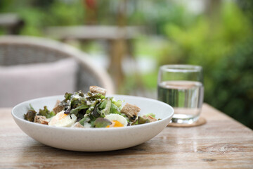 caesar salad appetizer on wooden background