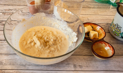 Preparing the dough and frying crepes in the home kitchen, natural light.