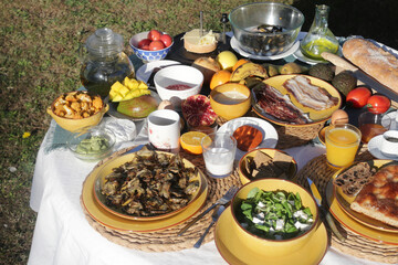 brunch with artichokes mussels croissants fruits brocoli feta salad ham bread and many other food and drink