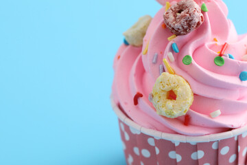 pink cupcake isolated in blue background