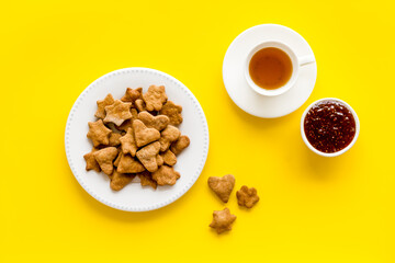 Freshly baked butter cookies with tea, top view