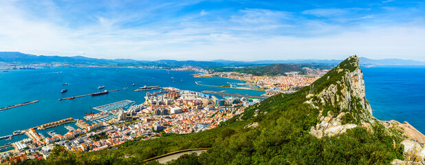 Colorful panoramic aerial view of the rock of Gibraltar, roof tops and the port of Gibraltar,...
