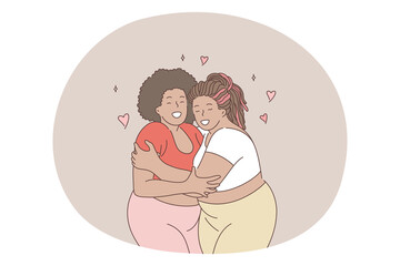 Overweight, obesity, plus size women concept. Young smiling black women friends in comfortable casual clothing standing hugging each other and enjoying spending time together living active happy life 