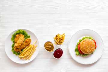 Overhead view of fast food - burger and french fries, flat lay