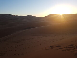 Obraz na płótnie Canvas Scenic View Of Desert Against Sky During Sunset