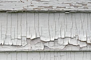 Cracking paint on side of house for use as a background.