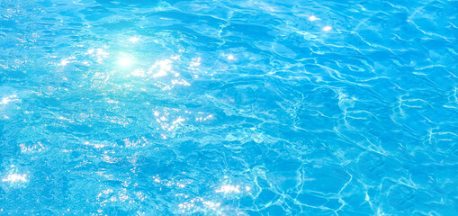 Fototapeta na wymiar blue swimming pool,background of water in swimming pool. texture, blue water, bright rays of the sun. web panorama banner with copy space.