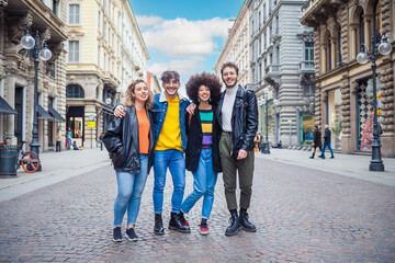 Group of diverse multithnic friends schoolmate or tourist outdoors having fun hugging