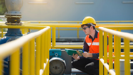 Portrait engineer wearing safety uniform checking the waste water treatment plant industry 