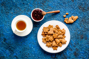 Freshly baked butter cookies with tea, top view