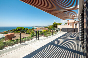 Fototapeta premium Sea view from a large terrace with a glass partition.