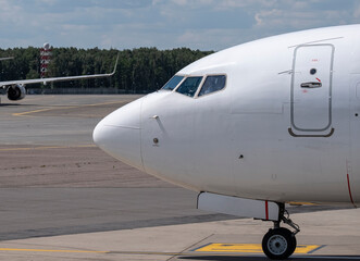 a large view of the nose of an aircraft at an international airport