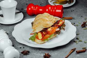 Delicious ham and cheddar cheese croissant with salad