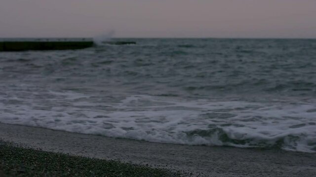 Sea surf waves close-up in the evening. Selective focus.