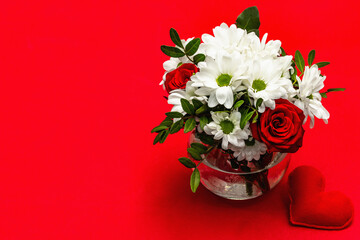 Bouquet of fresh flowers and felt heart for Valentine's day or Wedding