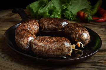 The sausage is stuffed with pork lungs, heart, rice in a frying pan. Gurka is a Hungarian and...