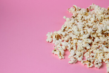 Popcorn on a pink background. There is a place for an inscription and a logo. Movie snack