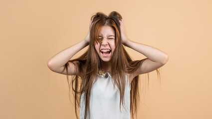 Fototapeta premium stressed girl kid shouting and touching hair, depression