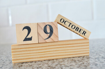 October 29, Cover design with number cube on a white background and granite table.