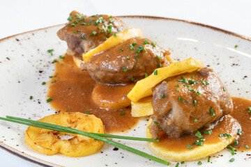 Old way stewed Iberian cheeks, with apple