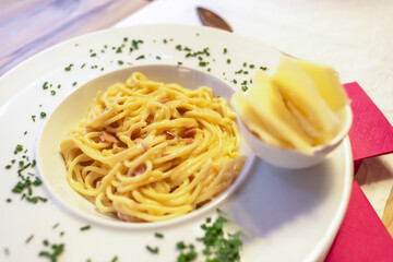 Italian pasta spaghetti in white plate, close up image, above view