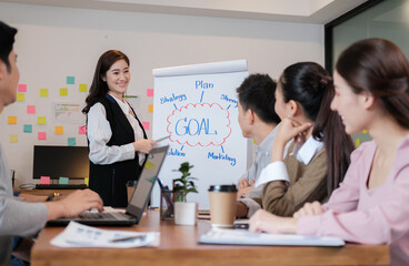 Portrait businesspeople standing by white board and giving presentation to colleagues during meeting in conference room. explaining something meeting to colleagues. Project results.