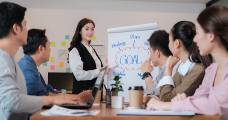 Group of Business putting forward suggestions to colleagues. Startup business team on meeting in modern bright office.They smiling and enjoying each others.
