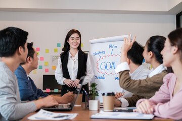 Portrait businesspeople standing by white board and giving presentation to colleagues during meeting in conference room. explaining something meeting to colleagues. Project results.