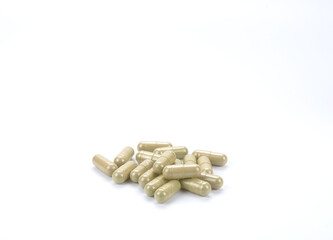 Herbal capsule on white background.