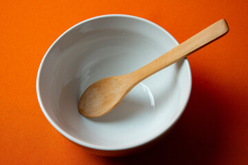 white bowl with orange background