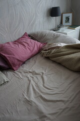 Fototapeta na wymiar Bed with duvet and blanket in the bedroom