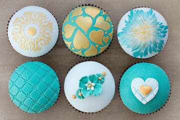 Teal and gold wedding cupcakes